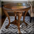F12. Round burlwood side table. 27"h x 28" 